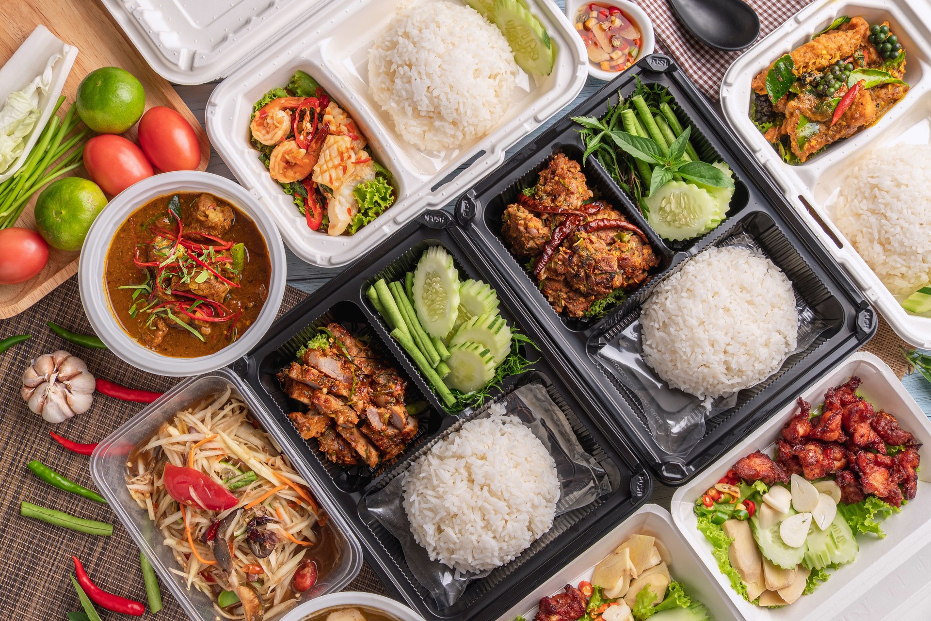 top table view of thai food in derivery box.